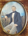 Miniature man sitting in the garden