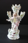 Figural stand with young man