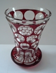 Cup with ruby glazing and cut lenses