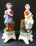 Figural pair of boy and girl on a pedestal