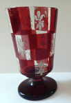 Glass on the stem with white lilies