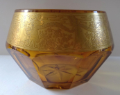 Bowl made of amber glass and gilded ornament