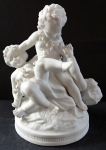 Sculpture of three children with a garland of flowers