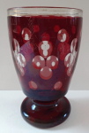 Glass, on low stem, with ruby staining