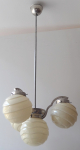 Chandelier made of white metal, with shaped balls