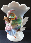 Vase with a figure of a girl and a basket