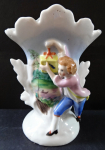 Vase with a boy with a gift