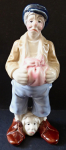 Statue of a man with his head at his feet