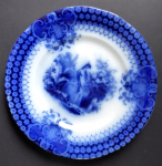 Blue stoneware plate with a peacock - Sarreguemines