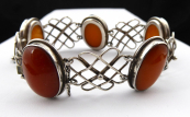 Silver bracelet with oval yellow medallions