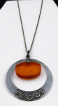 Silver necklace, circle, and oval amber