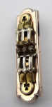 Gilded silver brooch with three rhinestones 