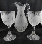 Pitcher and two glasses, cut flowers and leaves - England
