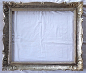 Patinated silver frame with carving