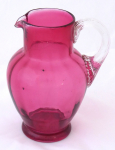 Pitcher made of pink and clear glass