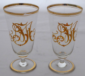 Two glasses with gilded monogram