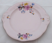 Pink plate with colourful flowers