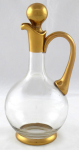 Round decanter heavily gilded