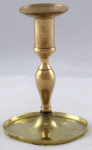 Small brass candlestick with higher handle