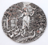 Girl with birds in the garden