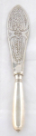 Decorative serving knife with silver handle