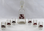 Carafe with ruby medallions and glasses