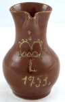 Brown jug with crown and year 1753