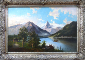 View of the Alpine lake with the town