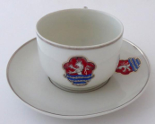 Cup with a saucer and the emblem of the city of Karlsbad
